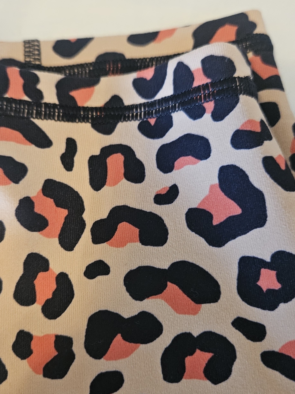 Fabletics PowerHold Leopard Print Leggings in Cream, Black & Orange - Picture 3 of 8